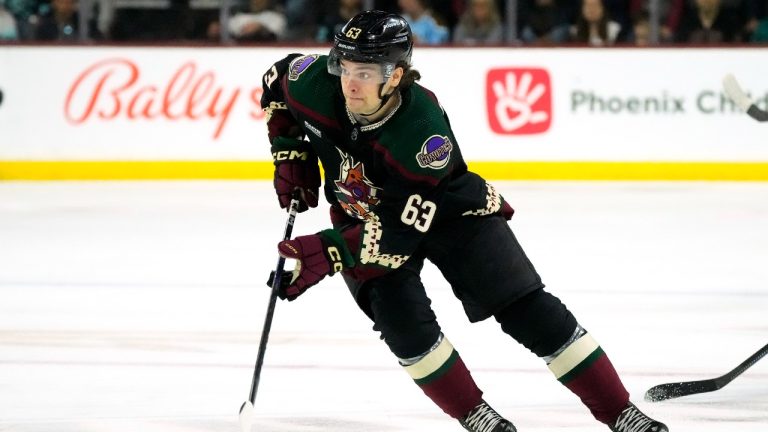 Arizona Coyotes' Matias Maccelli skates with the puck against the Seattle Kraken during the third period of an NHL hockey game April 10, 2023, in Tempe, Ariz. (Ross D. Franklin/AP)