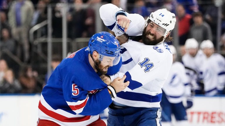 Tampa Bay Lightning's Pat Maroon (14) fights with New York Rangers' Ben Harpur (5) during the first period of an NHL hockey game Wednesday, April 5, 2023, in New York. (Frank Franklin II/AP)