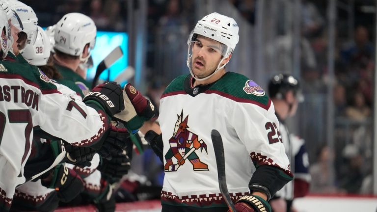 Arizona Coyotes center Jack McBain is congratulated as he passes the team bench after scoring a goal against the Colorado Avalanche in the first period of an NHL hockey game, Saturday, March 11, 2023, in Denver. (David Zalubowski/AP Photo)