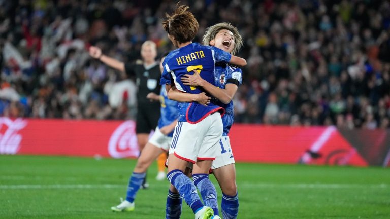 Japan's Hinata Miyazawa, left, is congratulated by teammate Mina Tanaka after scoring their first goal during the Women's World Cup Group C soccer match between Zambia and Japan in Hamilton, New Zealand, Saturday, July 22, 2023. (John Cowpland/AP)