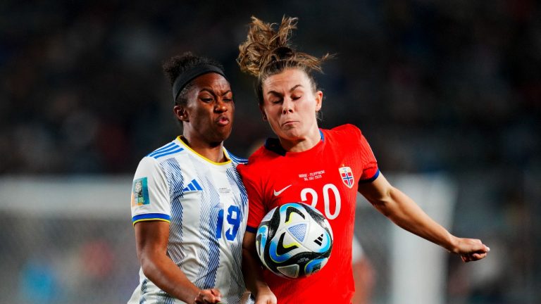 Philippines' Dominique Randle, left, and Norway's Emilie Haavi clash as they fight for the ball during the Women's World Cup Group A soccer match between Norway and Philippines at Eden Park stadium in Auckland, New Zealand, Sunday, July 30, 2023. Norway defeated Philippines 6-0. (Abbie Parr/AP Photo)