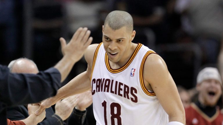 Cleveland Cavaliers' Anthony Parker (18) slaps hands with fans after hitting a basket at the buzzer against the Los Angeles Lakers at the end of the second quarter in their NBA basketball game in Cleveland on Wednesday, Feb. 16, 2011. (Amy Sancetta/AP Photo)