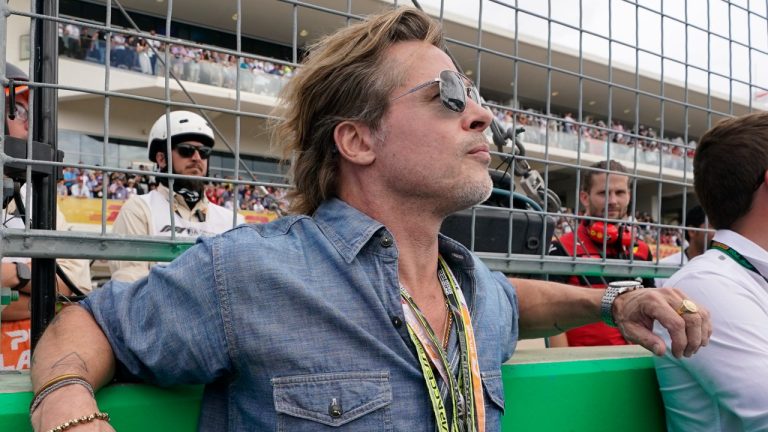 Actor Bad Pitt watches the pre race activities before the Formula One U.S. Grand Prix auto race at the Circuit of the Americas, Sunday, Oct. 23, 2022, in Austin, Texas. (Darron Cummings/AP)