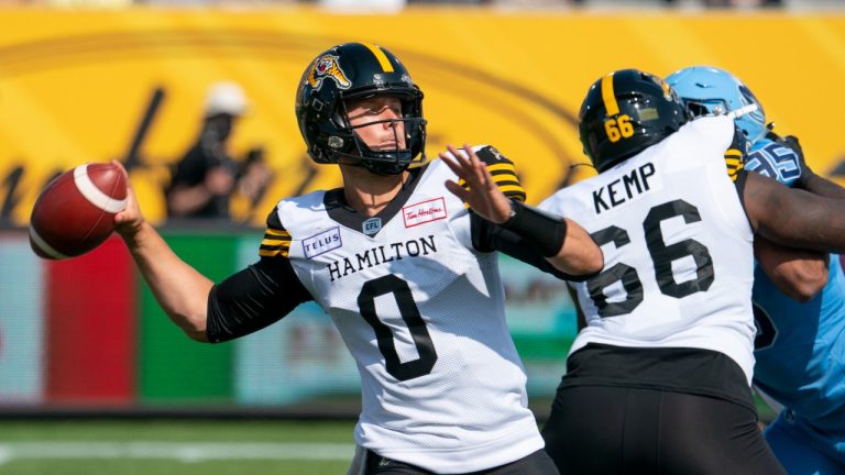 Hamilton Tiger Cats quarterback Taylor Powell (0) passes against the Toronto Argonauts during first half CFL pre-season football action in Hamilton on Saturday, May 27, 2023. (Peter Power/THE CANADIAN PRESS)