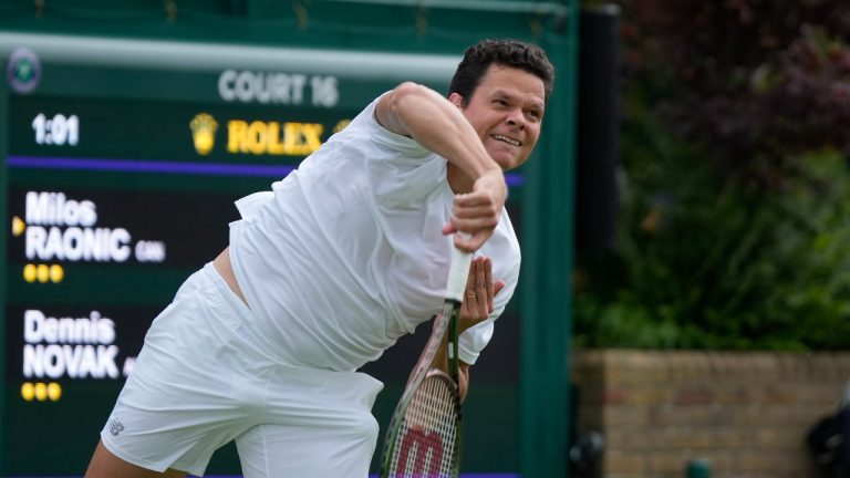 Canada's Milos Raonic serves to Austria's Dennis Novak during the men's singles match on day three of the Wimbledon tennis championships in London, Wednesday, July 5, 2023. (Alastair Grant/AP Photo)