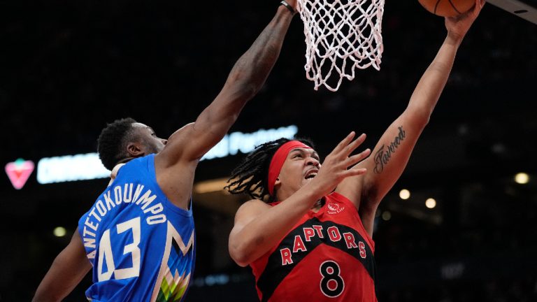 Milwaukee Bucks forward Thanasis Antetokounmpo (43) tries to stop Toronto Raptors forward Ron Harper Jr. (8) as he goes for the layup during second half NBA basketball action in Toronto, Sunday, April 9, 2023. (Frank Gunn/CP)