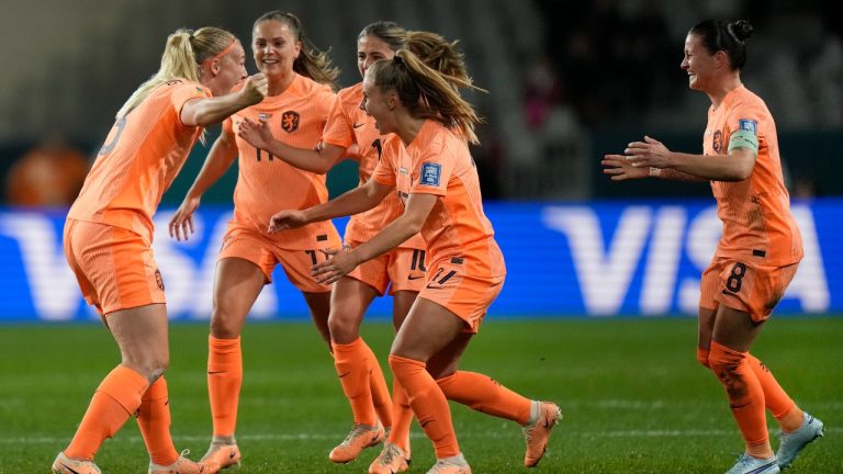 Netherlands' Stefanie Van der Gragt, left, celebrates with teammates after her goal was confirmed during the first half of the FIFA Women's World Cup Group E soccer match between the Netherlands and Portugal in Dunedin, New Zealand, Sunday, July 23, 2023. (Alessandra Tarantino/AP)