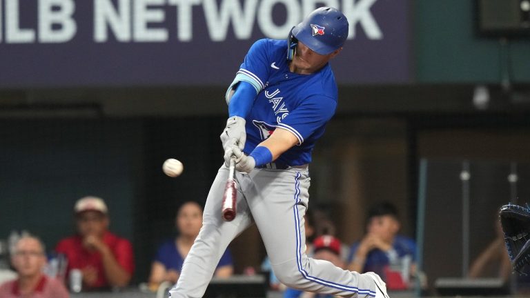 Toronto Blue Jays' Daulton Varsho hits a solo home run during the fourth inning of a baseball game against the Texas Rangers in Arlington, Texas, Saturday, June 17, 2023. (LM Otero/AP)