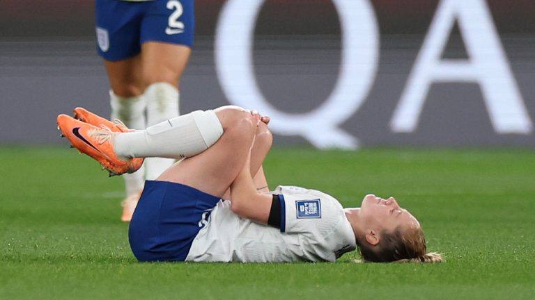 England's Keira Walsh holds her knee before being carried off the field during the Women's World Cup Group D soccer match between England and Denmark at Sydney Football Stadium in Sydney, Australia, Friday, July 28, 2023. (Sophie Ralph/AP Photo)