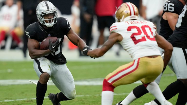 Las Vegas Raiders running back Zamir White (35) runs as San Francisco 49ers cornerback Ambry Thomas (20) defends during the first half of an NFL preseason football game, Sunday, Aug. 13, 2023, in Las Vegas. (John Locher/AP)