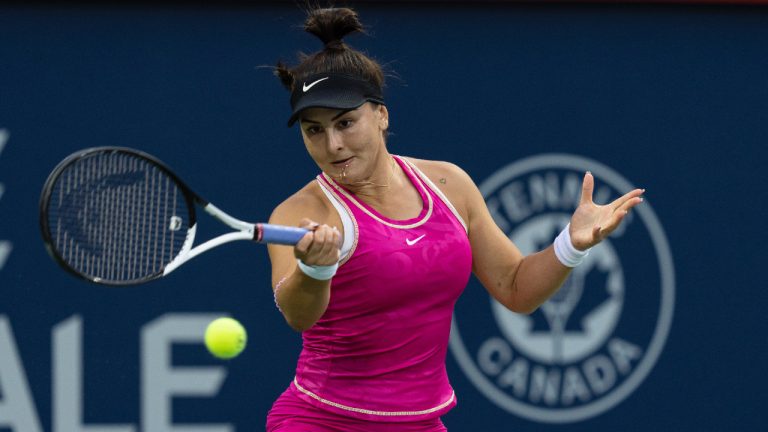 Bianca Andreescu of Canada, hits a return to Camila Giorgi of Italy, during the National Bank Open tennis tournament in Montreal, Tuesday, August 8, 2023. (Christinne Muschi/CP)