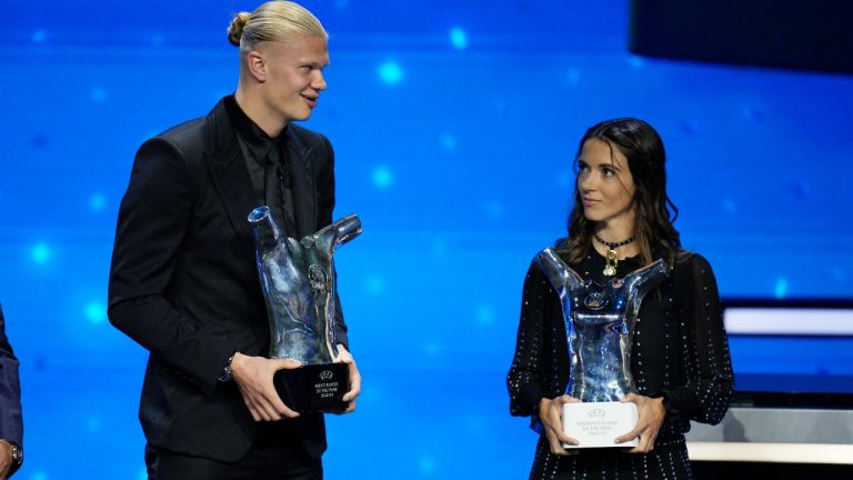 Spain's Aitana Bonmati, right, holds the UEFA Women's Player of the Year award as Norwegian's Erling Haaland holds the UEFA Men's Player of the Year award after the 2023/24 UEFA Champions League group stage draw at the Grimaldi Forum in Monaco, Thursday, Aug. 31, 2013. (Daniel Cole/AP)