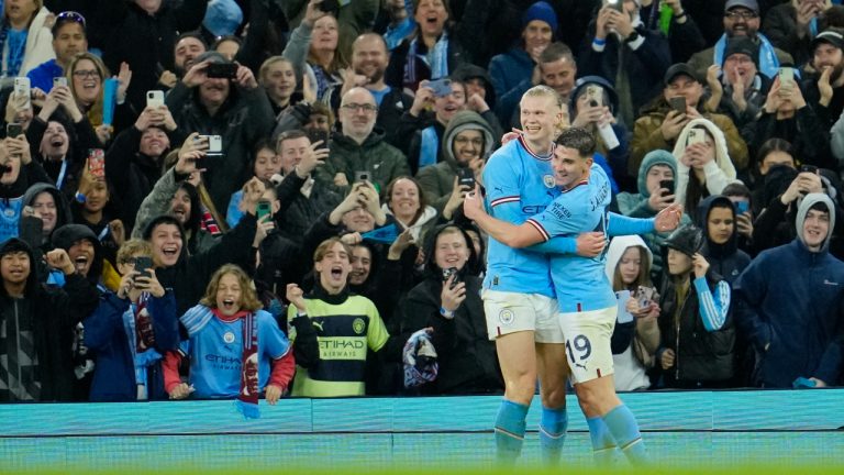 Manchester City's Erling Haaland celebrates with teammates after scoring his side's third goal during the English FA Cup quarter final soccer match between Manchester City and Burnley at the Etihad stadium in Manchester, England, Saturday, March 18, 2023. (Jon Super/AP)