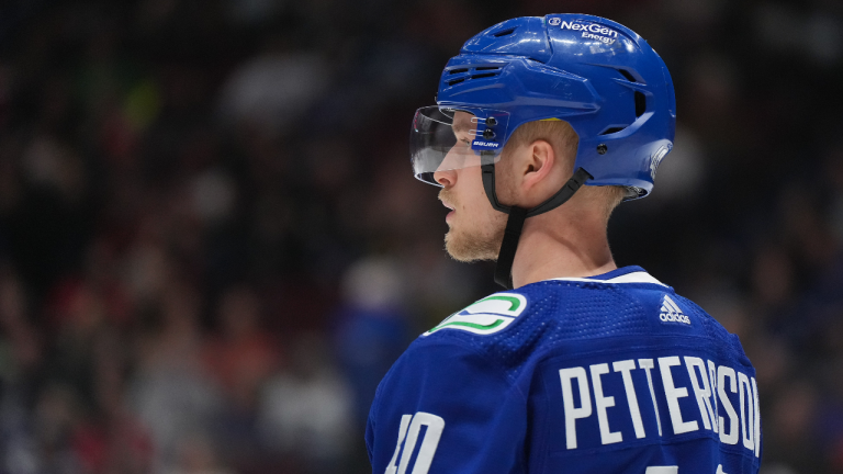 Vancouver Canucks' Elias Pettersson waits for a faceoff against the Calgary Flames during the first period of an NHL hockey game in Vancouver, on Friday, March 31, 2023. (CP)