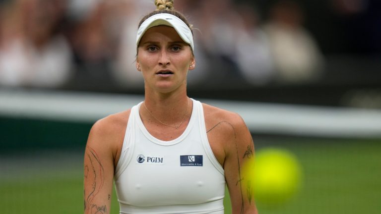 Czech Republic's Marketa Vondrousova looks at the ball as she plays Tunisia's Ons Jabeur in the women's singles final on day thirteen of the Wimbledon tennis championships in London, Saturday, July 15, 2023. (AP Photo/Alastair Grant) 