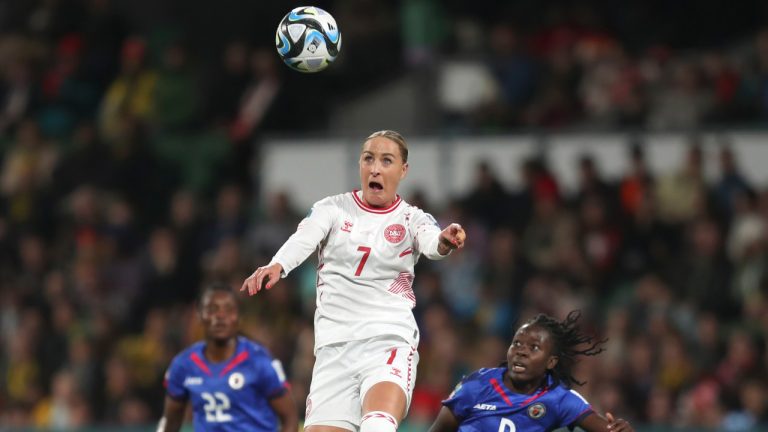 Denmark's Sanne Troelsgaard heads the ball ahead of Haiti's Sherly Jeudy, right, during the Women's World Cup Group D soccer match between Haiti and Denmark in Perth, Australia, Tuesday, Aug. 1, 2023. (Gary Day/AP) 