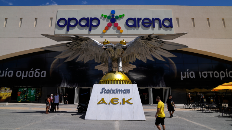 People gather outside OPAP Arena, following overnight clashes between rival supporters in Nea Philadelphia suburb, in Athens, Greece, Tuesday, Aug. 8, 2023. (AP)