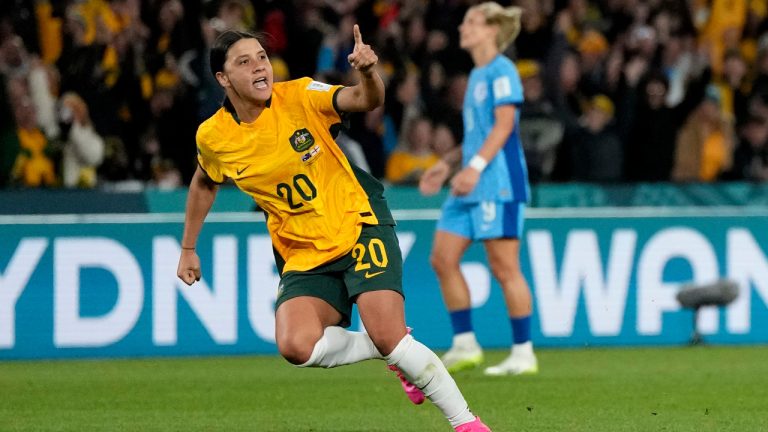 Australia's Sam Kerr celebrates after scoring her side's first goal during the Women's World Cup semifinal soccer match between Australia and England at Stadium Australia in Sydney, Australia, Wednesday, Aug. 16, 2023. (Rick Rycroft/AP) 