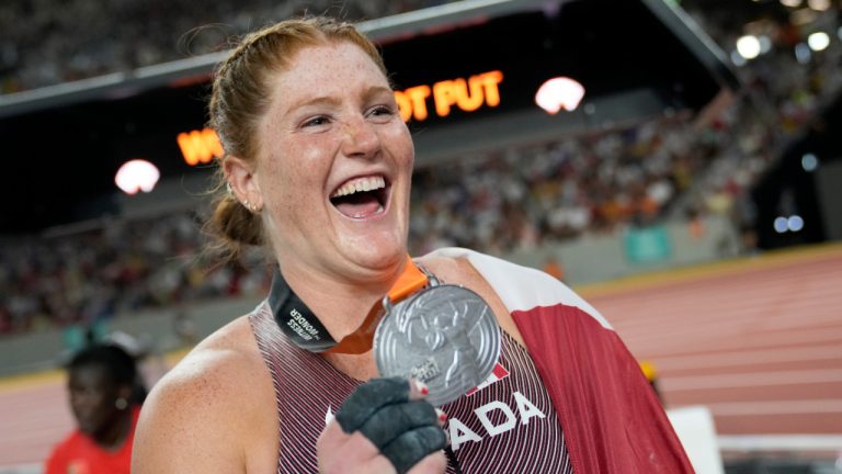 Sarah Mitton, of Canada, poses after after winning the silver medal in the Women's shot put final during the World Athletics Championships in Budapest, Hungary, Saturday, Aug. 26, 2023. (Matthias Schrader/AP) 