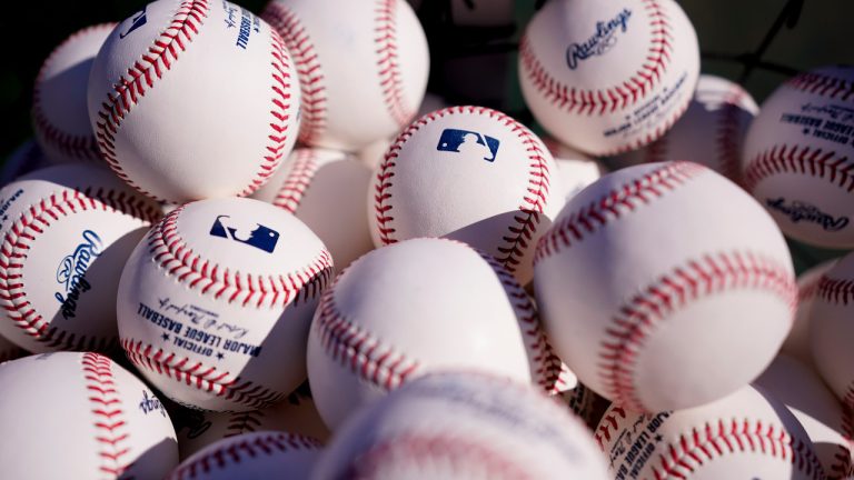 MLB baseballs fill a bag on the field ahead of Game 4 of baseball's National League Division Series between the Philadelphia Phillies and the Atlanta Braves, Saturday, Oct. 15, 2022, in Philadelphia. (AP Photo/Matt Slocum) 