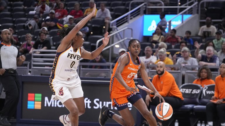 Connecticut Sun's Tiffany Hayes (15) goes to the basket against Indiana Fever's Kelsey Mitchell during the first half of a WNBA basketball game Friday, Aug. 4, 2023, in Indianapolis. (Darron Cummings/AP)