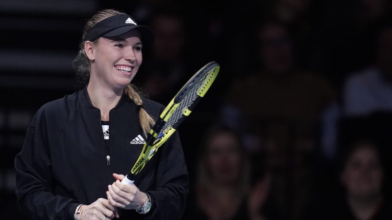 Denmark's Caroline Wozniacki smiles prior to playing Germany's Angelique Kerber in a testimonial tennis match, in Copenhagen, Denmark, Tuesday April 5, 2022. (Liselotte Sabroe/Ritzau Scanpix via AP)