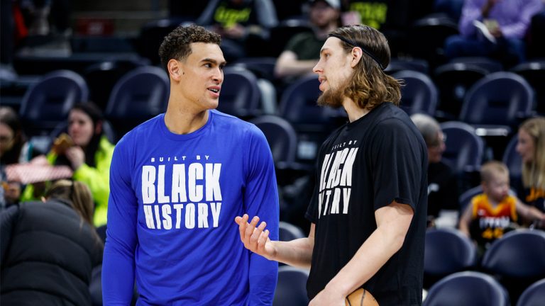 Team Canada bigs Dwight Powell (left) and Kelly Olynyk talk before an NBA game in February. (Photo by Jeff Swinger/NBAE via Getty Images)