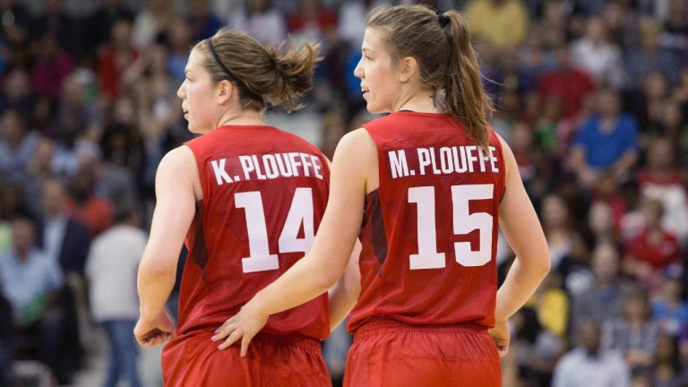 Michelle Plouffe (right) jogs back to her defensive position with sister Katherine during women's basketball action against Argentina at the Pan Am games in Toronto on Friday, July 17, 2015. (Chris Young/CP)