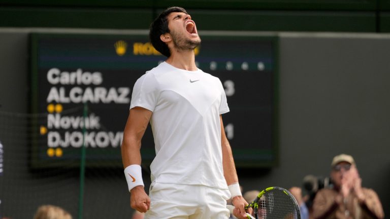 Spain's Carlos Alcaraz celebrates after winning a point against Serbia's Novak Djokovic in the final of the men's singles on day fourteen of the Wimbledon tennis championships in London, Sunday, July 16, 2023. (AP Photo/Kirsty Wigglesworth)