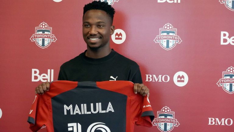 Newly signed Toronto F.C. forward Cassius Mailula, of South Africa, shows off his jersey at the team's training facility in Toronto, Friday, Aug. 18, 2023. (Neil Davidson/CP Photo)