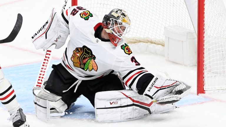 Chicago Blackhawks goaltender Alex Stalock (32) gloves a shot by the Nashville Predators during the third period of an NHL hockey game Thursday, March 16, 2023, in Nashville, Tenn. (Mark Zaleski/AP)