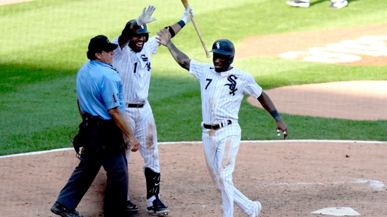 After stealing third, Chicago White Sox's Tim Anderson scores the game winning run on a throwing error by Seattle Mariners shortstop J.P. Crawford as Elvis Andrus and home plate umpire Phil Cuzzi watch in a baseball game Wednesday, Aug. 23, 2023, in Chicago. The White Sox won 5-4. (Charles Rex Arbogast/AP)