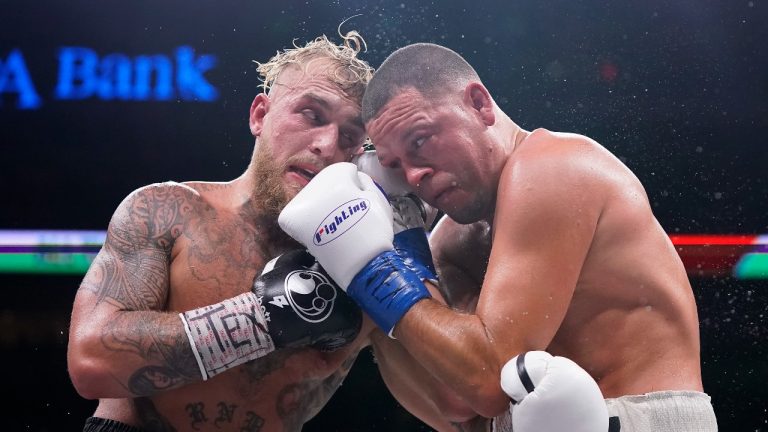 Jake Paul, left, and Nate Diaz, right, trade punches during the tenth round of their fight at the American Airlines Center on August 05, 2023 in Dallas, Texas. (Sam Hodde/Getty Images)
