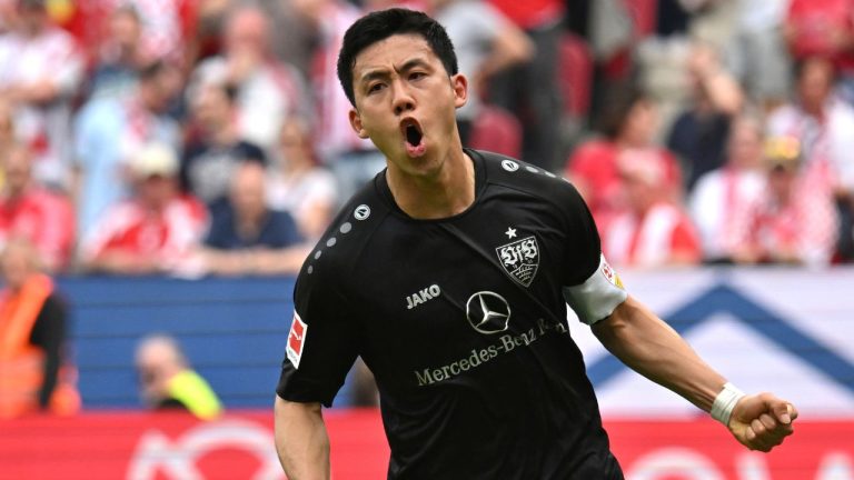 Stuttgart's Wataru Endo celebrates scoring during the Bundesliga soccer match between FSV Mainz 05 - VfB Stuttgart at Mewa Arena, in Mainz, Germany, Sunday May 21, 2023. (Torsten Silz/dpa via AP)