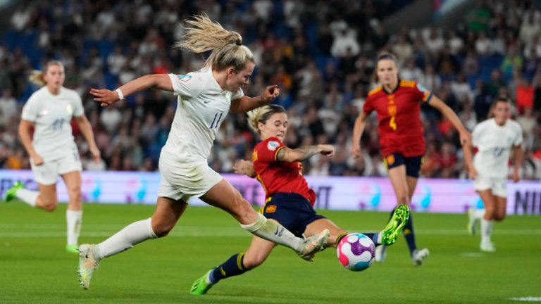 England's Lauren Hemp, centre left, and Spain's Aitana Bonmati challenge for the ball during the Women Euro 2022 quarter final soccer match between England and Spain at the Falmer stadium in Brighton, Wednesday, July 20, 2022. (Alessandra Tarantino/AP)