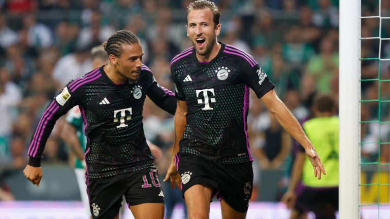 Bayern's Harry Kane celebrates scoring with teammate Leroy Sane, during the German Bundesliga soccer match between Werder Bremen and Bayern Munich, at the Weserstadion in Bremen, Germany, Friday, Aug. 18, 2023. (Axel Heimkendpa via AP)