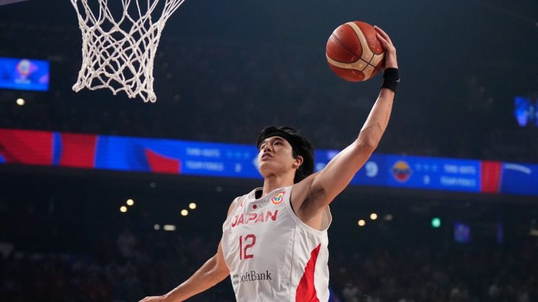 Japan forward Yuta Watanabe (12) dunks against Venezuela in the first half of their Basketball World Cup classification match in Okinawa, southern Japan, Thursday, Aug. 31, 2023. (Hiro Komae/AP)