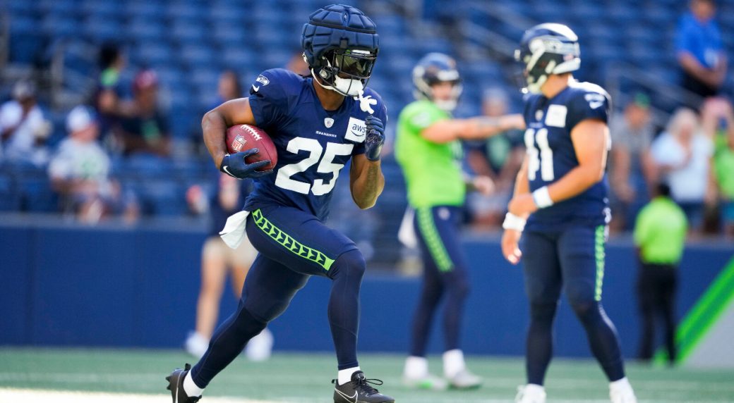 Tre Flowers of the Seattle Seahawks runs off of the field after the