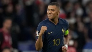 France's Kylian Mbappe celebrates after scoring the opening goal by a penalty shoot during the Euro 2024 group B qualifying soccer match between France and Greece at the Stade de France, outside Paris, Monday, June 19, 2023. (Christophe Ena/AP)