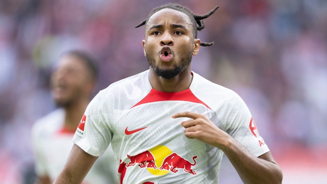 Leipzig's Christopher Nkunku celebrates after his goal during the Bundesliga soccer match between RB Leipzig and Bayer Leverkusen in Leipzig, Germany, Saturday, Oct. 29, 2022. (Sebastian Kahnert/dpa via AP)