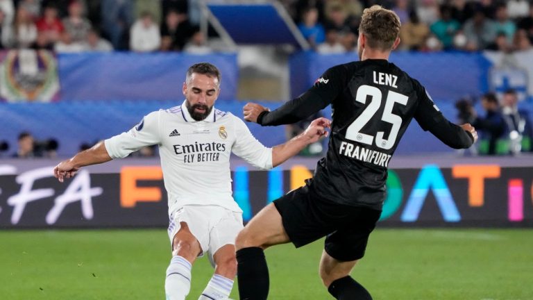 Real Madrid's Dani Carvajal, left, duels for the ball with Frankfurt's Christopher Lenz during the UEFA Super Cup final soccer match between Real Madrid and Eintracht Frankfurt. (Sergei Grits/AP)