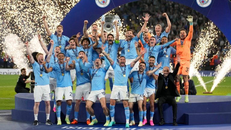 Manchester City's team captain Ilkay Gundogan lifts the trophy after winning the Champions League final soccer match between Manchester City and Inter Milan at the Ataturk Olympic Stadium in Istanbul, Turkey, Sunday, June 11, 2023. Manchester City won 1-0. (Francisco Seco/AP)