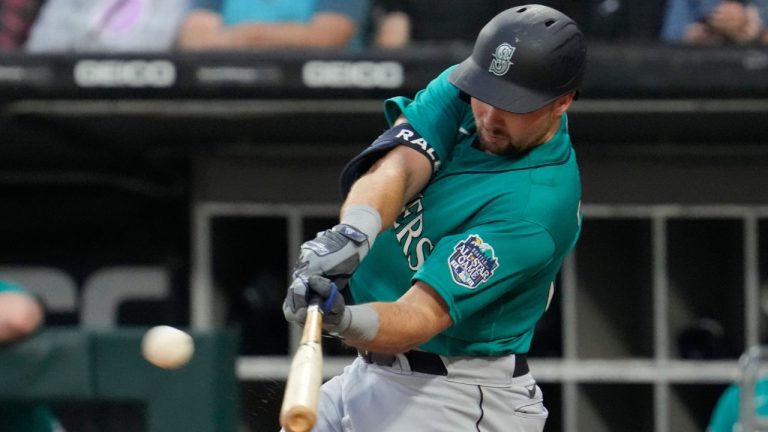 Seattle Mariners' Cal Raleigh hits a two-run double during the first inning of a baseball game against the Chicago White Sox in Chicago, Monday, Aug. 21, 2023. (Nam Y. Huh/AP Photo)