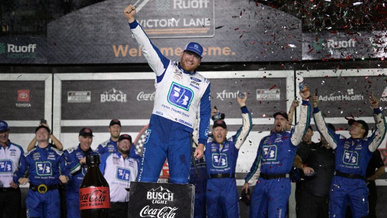 Chris Buescher, centre, celebrates in Victory Lane with team members after winning the NASCAR Cup Series auto race at Daytona International Speedway, Saturday, Aug. 26, 2023, in Daytona Beach, Fla. (Phelan M. Ebenhack/AP)