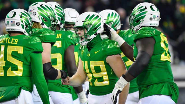 Oregon place kicker Camden Lewis (49) celebrates with teammates after kicking a field goal against Utah during the second half of an NCAA college football game Saturday, Nov. 19, 2022, in Eugene, Ore. The Big Ten has cleared the way for Oregon and Washington to apply for membership, four people familiar with the negotiations told The Associated Press., Friday, Aug. 4, 2023 (Andy Nelson/AP)