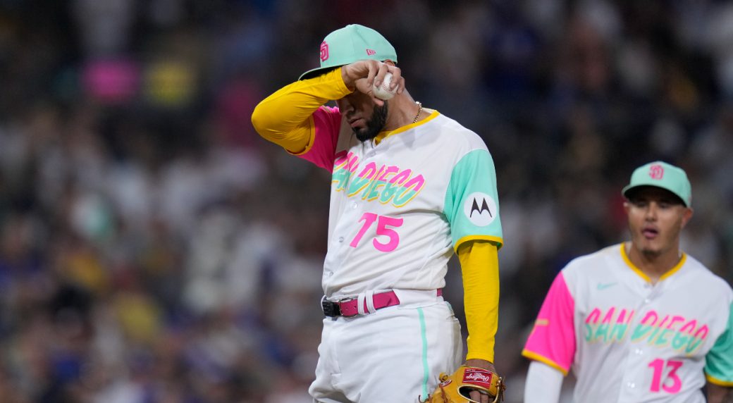 Robert Suarez of the San Diego Padres pitches in the eighth inning