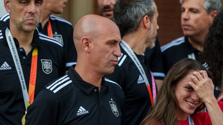 Luis Rubiales, centre, stands with Spain's Women's World Cup soccer team after their World Cup victory at La Moncloa Palace in Madrid, Spain, Tuesday, Aug. 22, 2023. (Manu Fernandez/AP Photo)