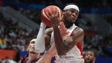 Canada uses second-half surge to beat Latvia, finish first in Group H