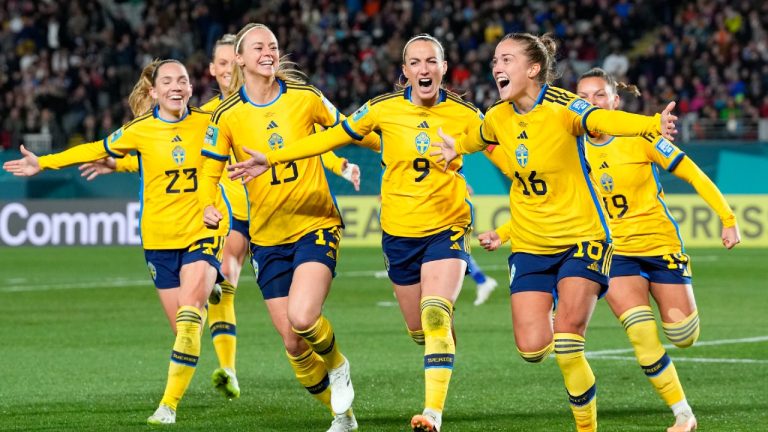 Sweden's Filippa Angeldal, foreground right, celebrates after scoring her side's second goal from the penalty spot during the Women's World Cup quarterfinal soccer match between Japan and Sweden at Eden Park in Auckland, New Zealand, Friday, Aug. 11, 2023. (Abbie Parr/AP)