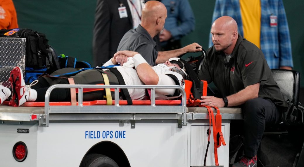 The Latest: Broncos' Bridgewater taken off on stretcher